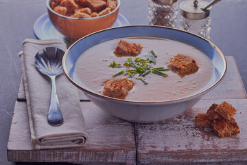 Dish of parsnip soup with croutons.