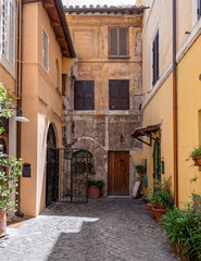Fototapeta na wymiar Rome Italy, Trastevere old neighborhood picturesque street view