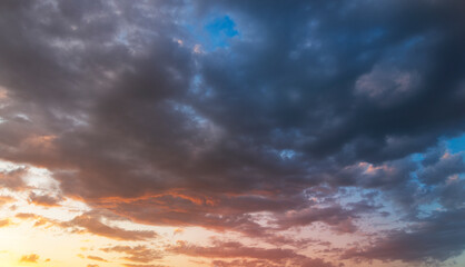Beautiful bright sunset sky. Dramatic colorful clouds after sunset. Nature, sunset clouds backgrounds.