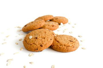 Crunchy oatmeal cookies and oatmeal isolated on a white background. Selective focus. Festival Of Homemade Cookies. 