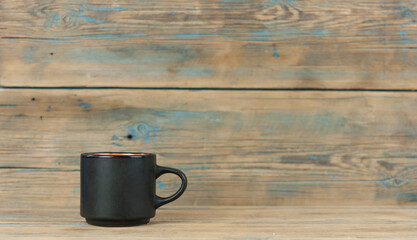 hot coffee cup and smoke on wooden dark background