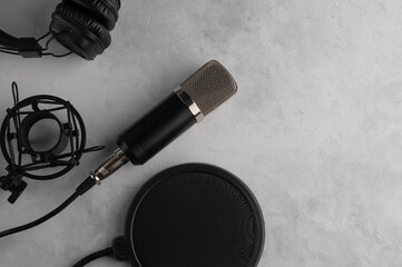 Close up studio condenser microphone with pop filter and anti-vibration mount live recording on...