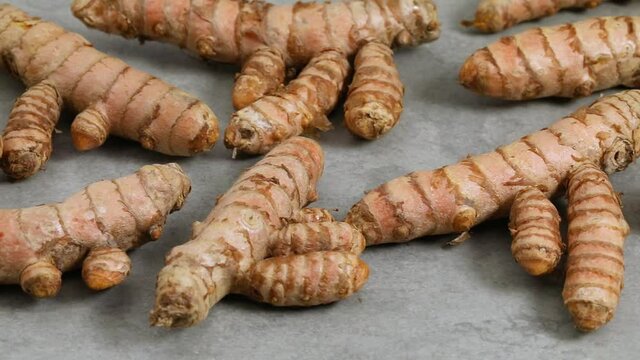Fresh healthy turmeric in slices to ground
