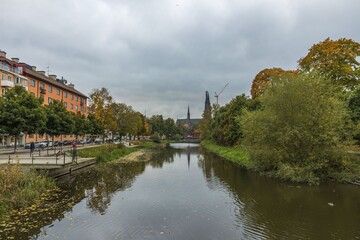 Gorgeous view on town street with cathedral on background in autumn day. Tourism, travel concept. Europe, Sweden, Uppsala.