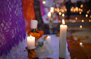 candle over shrine close up