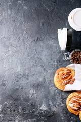 Baked cinnamon buns served with coffee