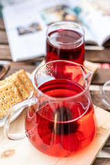 Cup of healthy winter brewed tea with herbs. Tea for immunity, ingredients for the treatment of colds.