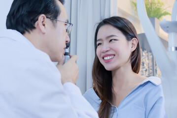 Fototapeta premium Portrait of asian woman doing eye test with Ophthalmologist