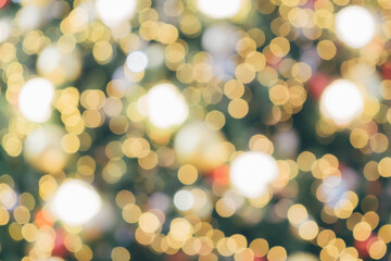 Obraz premium Abstract christmas holiday with festive gold bokeh light on tree blurred background