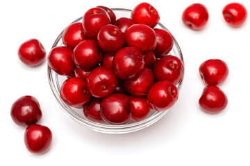 fresh black cherries in a glass plate on a white background