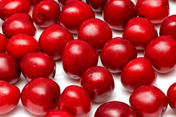 fresh black cherries on a white background