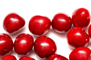 fresh black cherries on white background