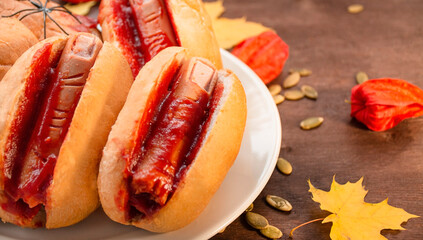 Halloween food. Halloween hot dog. Bloody fingers from sausages in rolls with ketchup. Scary food....