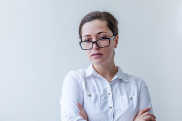 Beautiful happy girl smiling. Beauty simple portrait young smiling brunette woman in eyeglasses isolated on white background. Young european woman portrait, true emotions. Copy space