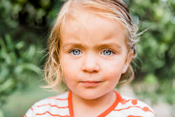 Toddler girl portrait in garden