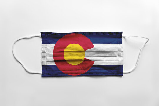 Face Mask With Colorado Flag Printed, On White Background, Isolated