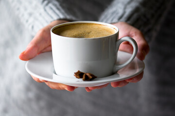 cup of coffee in hand