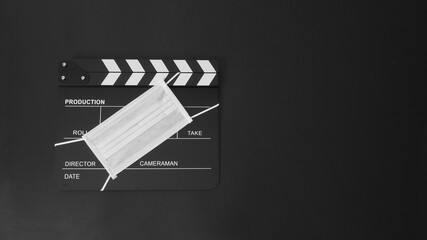 Clapper board or movie slate with face mask. it use in video production and cinema industry on...