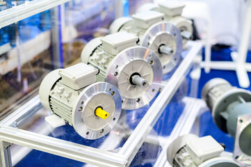 Several electric motors are shown in the shop.