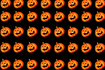 Pattern. On a black background, a lot of pumpkins with a carved smile. Pumpkins standing in glad. Halloween celebration concept.