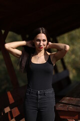 young brunette straightening her hair with her hands
