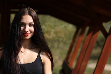 Young long-haired beautiful brunette woman