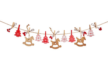 Christmas garland made of wooden toys and red berries isolated on white background