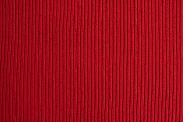 Red knitted fabric texture as background