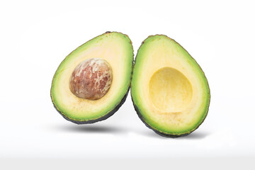 Avocado cut into halv isolated on with background with clipping path.