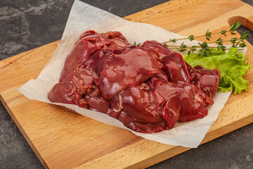 Raw chicken liver over board