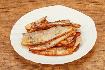 Roasted juicy bacon in the plate