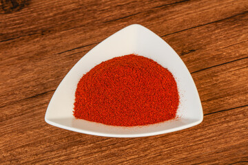 Dry paprika powder in the bowl