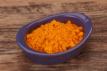 Tumeric powder in the bowl