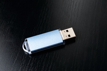 Flash drive on a black wooden table
