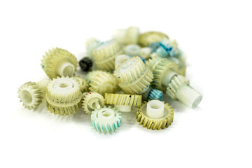Dirty plastic gears on white background
