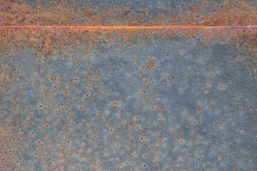 Grunge rusted metal texture, rust, and oxidized metal background. Old metal iron panel. Abstract art with a line and space to input text.