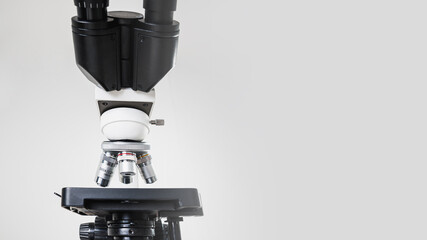Using a biological microscope. Close up of a microscope. Scientific research concept, using a...