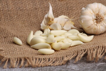 Raw garlic Cloves and Bulb. on barlup.