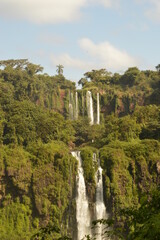 Fototapeta na wymiar Rainbows over the mighty and powerful Iguzu (Iguacu) Waterfalls between Brazil and Argentina