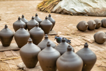 Fototapeta na wymiar Nepal pottery Beehive Money Banks drying out before firing.