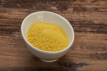 Raw cous cous heap in the bowl