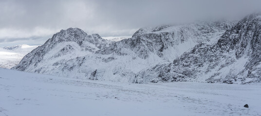 Fototapeta premium Tryfan and Glyders bathed in the snow during winter, Snowdonia National Park, Wales