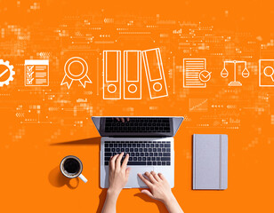 Compliance theme with person using a laptop computer