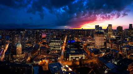 Vancouver, British Columbia, Canada. Aerial Panoramic View of Downtown City during Twilight. Dramatic Colorful Sunset Sky Composite. Modern Architecture Skyline