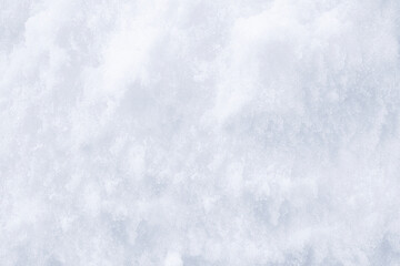 Background of fresh snow texture. Winter texture. Snowy white texture. Snowflakes.