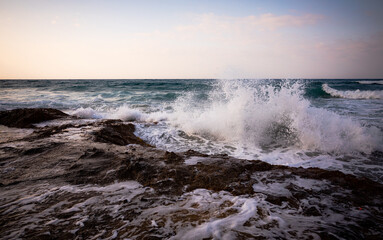 Explosive waves crashing by the shore