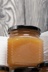 Fruit jam in jars. Stands in a wooden box painted white.