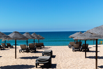 beach chairs and umbrellas on the beach