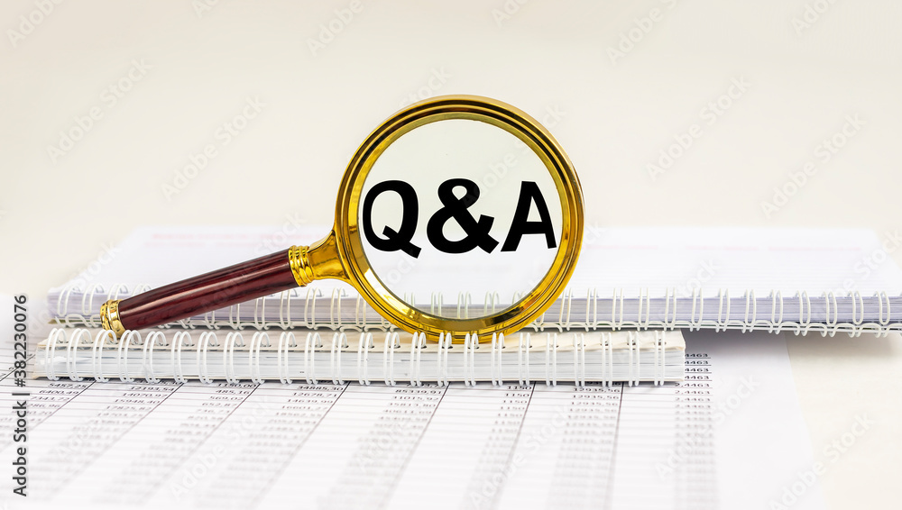 Poster questions and answers concept, q and a - magnifying glass, notebook on office table with documents