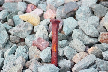 Rusty Nail in stones